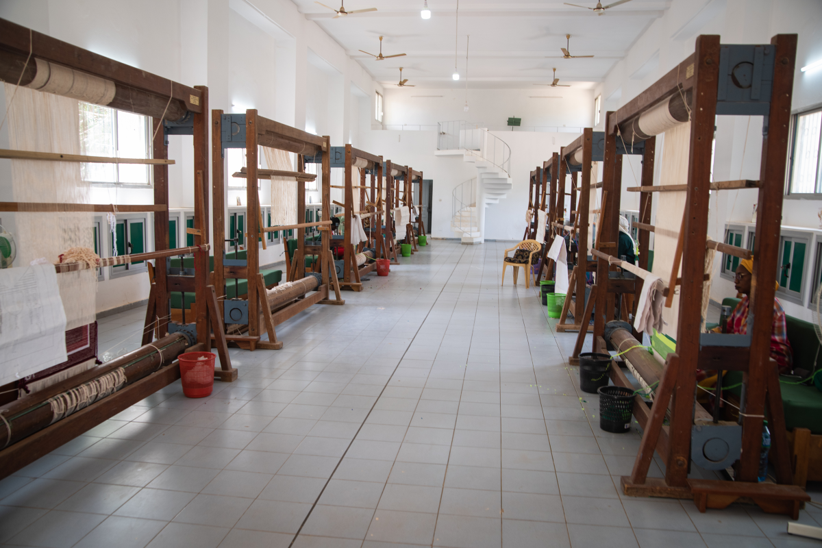 Interior of the tapestry workshop in Thiès, Senegal, where master artisans create world-renowned handwoven African tapestries.